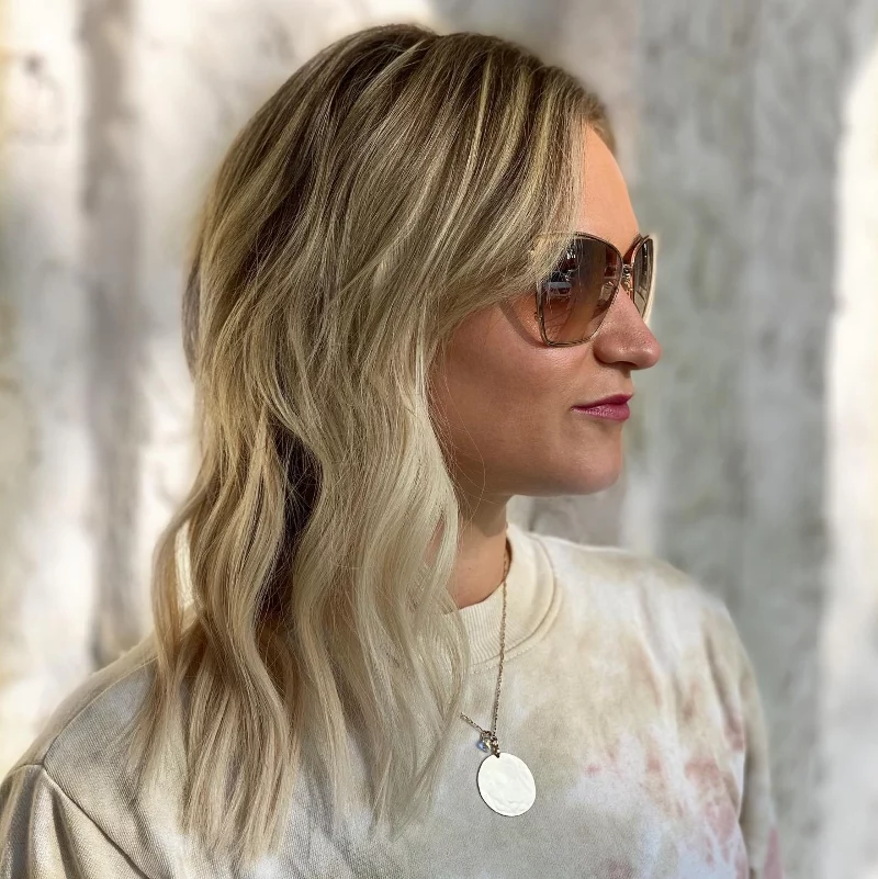 blonde woman wearing sunglasses